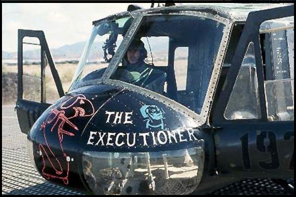 Arthur sitting in the cabin of a UH-1 Iroguois "Huey helicopter, unkown date.